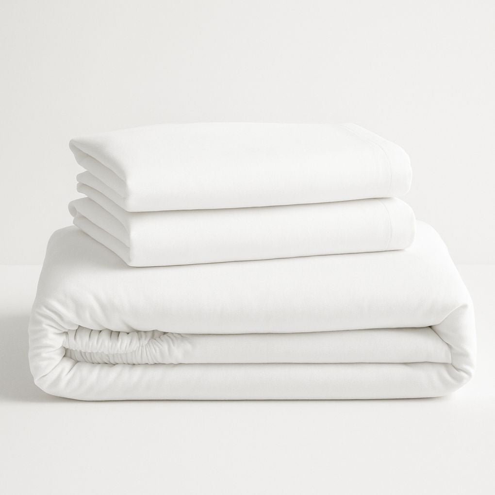 Stack of white folded bedsheet set 