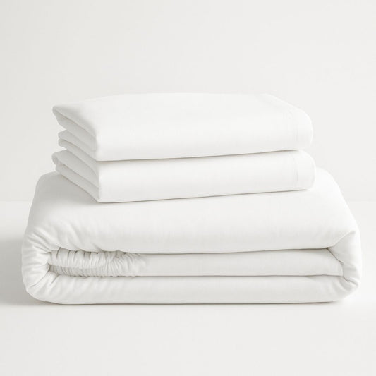 Stack of white folded bedsheet set 